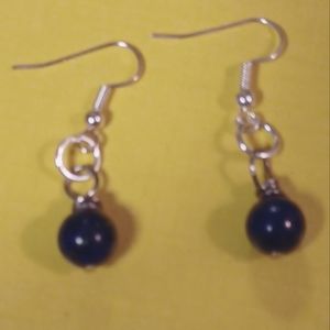 A pair of lapis lazuli earrings.